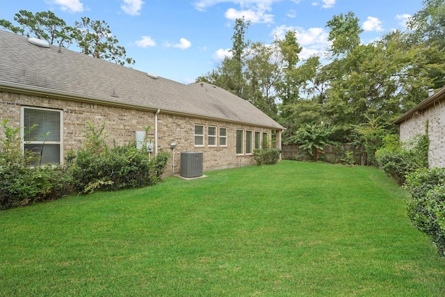 view of yard with central AC