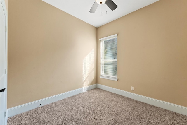 empty room with ceiling fan and carpet flooring