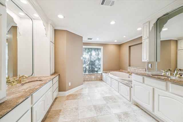 bathroom with ornamental molding, a bath, and vanity