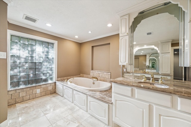 bathroom with crown molding, tile patterned floors, vanity, and a bathtub