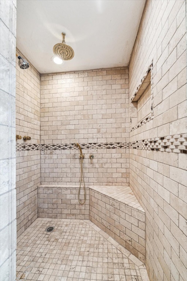 bathroom featuring a tile shower