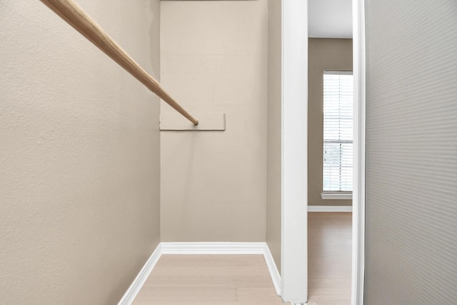 spacious closet featuring light hardwood / wood-style floors