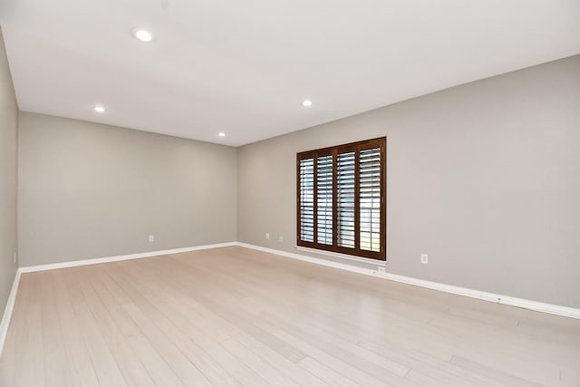 unfurnished room featuring light hardwood / wood-style floors