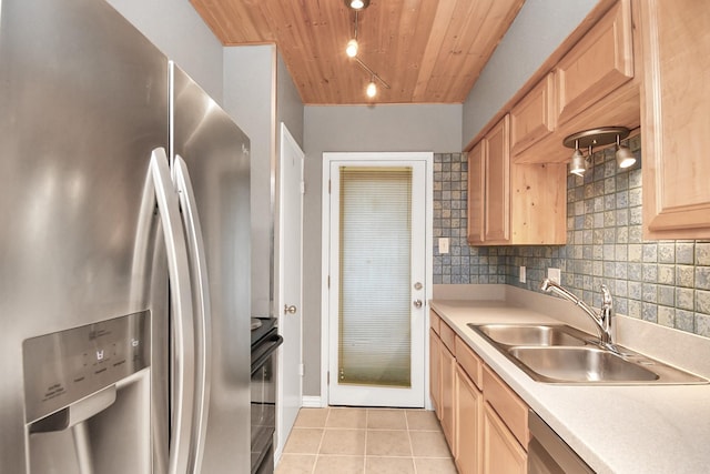 kitchen featuring sink, stainless steel fridge with ice dispenser, light tile patterned floors, wood ceiling, and range