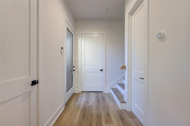 hallway with light wood-type flooring