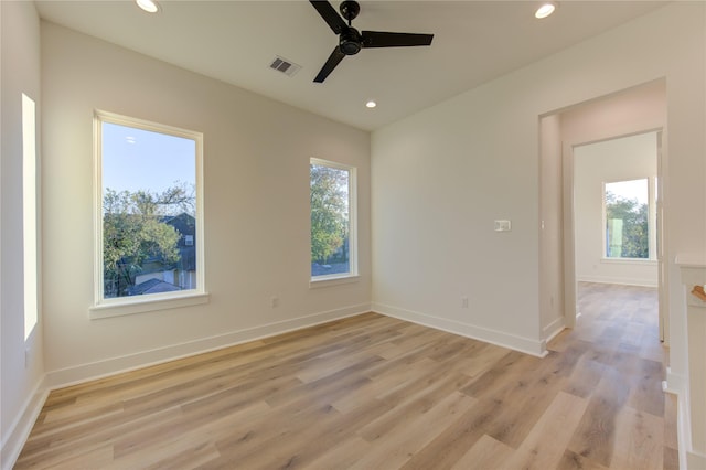 unfurnished room featuring ceiling fan and light hardwood / wood-style floors