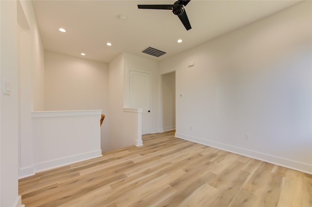 spare room with ceiling fan and light hardwood / wood-style floors