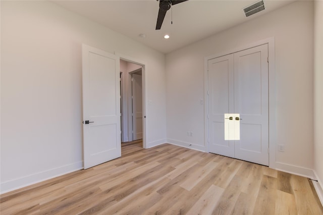 unfurnished bedroom featuring ceiling fan and light hardwood / wood-style flooring