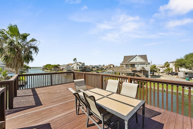 wooden terrace featuring a water view