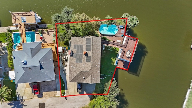 birds eye view of property featuring a water view