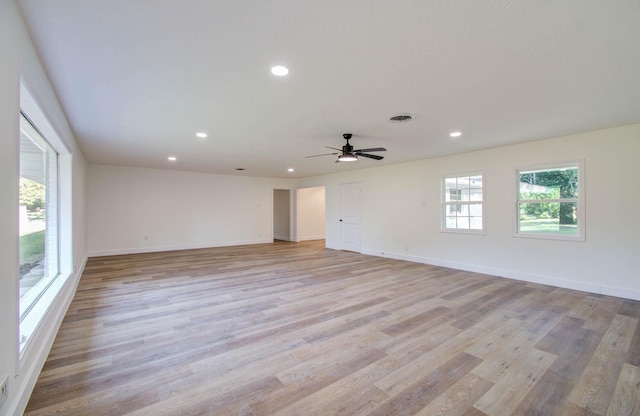 spare room with light hardwood / wood-style flooring and ceiling fan