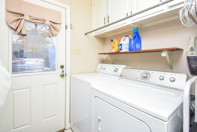 laundry area featuring cabinet space and washer and clothes dryer