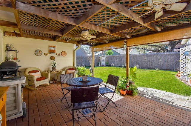 deck with a lawn, a patio area, a fenced backyard, and a pergola