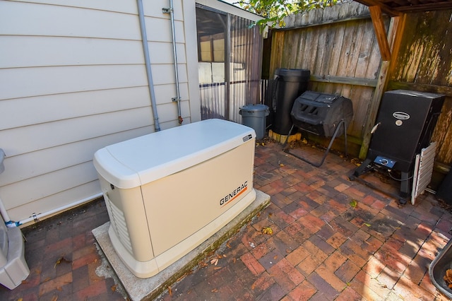 exterior details featuring fence and a power unit