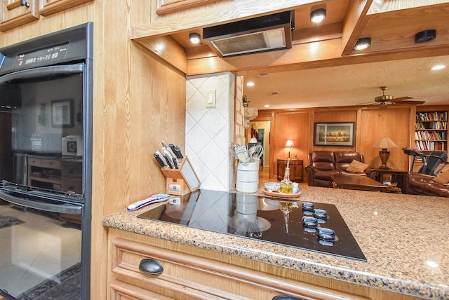 kitchen with decorative backsplash, a ceiling fan, light stone countertops, black electric stovetop, and recessed lighting