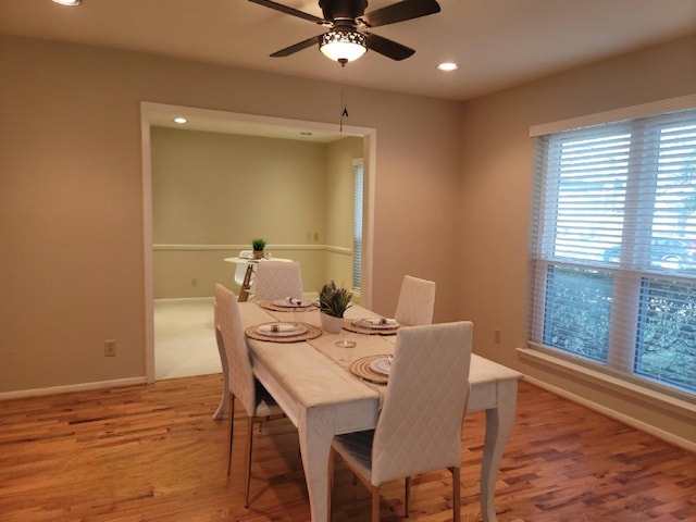 dining area with light wood finished floors, baseboards, a ceiling fan, and recessed lighting