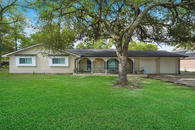 single story home with a front yard and a garage