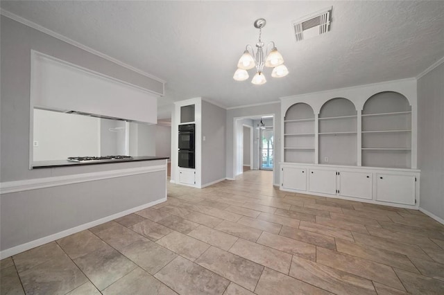 interior space featuring ceiling fan with notable chandelier, built in features, ornamental molding, and a textured ceiling