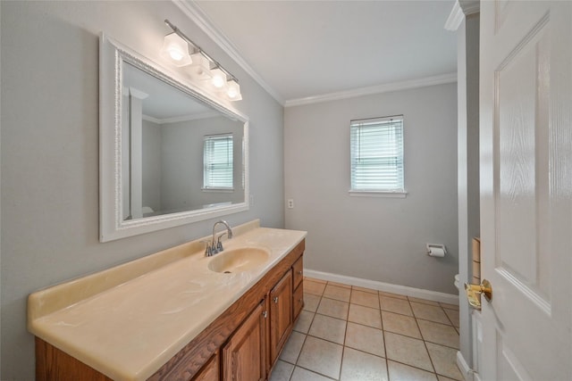 bathroom with tile patterned floors, crown molding, vanity, and toilet