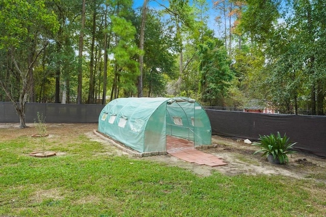 view of outbuilding with a yard