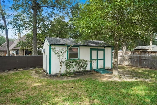 view of outdoor structure featuring a lawn