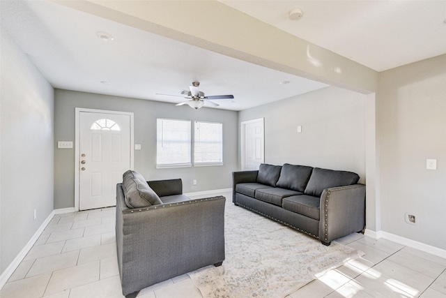 living room with ceiling fan and light tile patterned floors