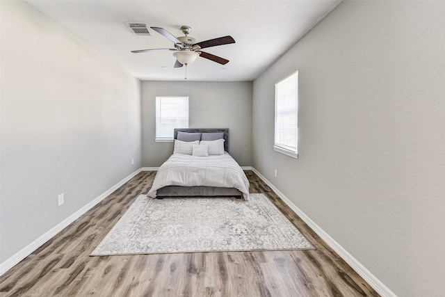 unfurnished bedroom with hardwood / wood-style floors and ceiling fan