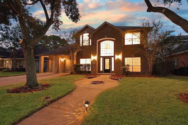 view of property featuring a lawn