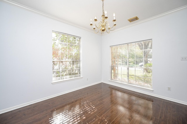 unfurnished room featuring ornamental molding, dark wood-type flooring, and a notable chandelier