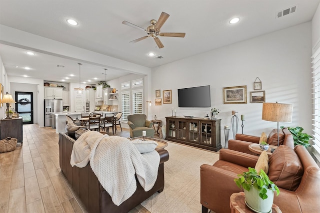 living room with ceiling fan