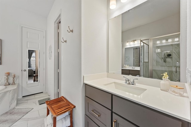 bathroom featuring separate shower and tub and vanity