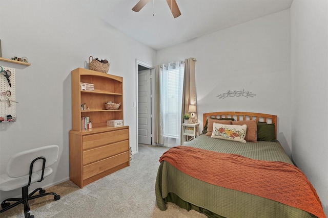 bedroom with ceiling fan and light colored carpet