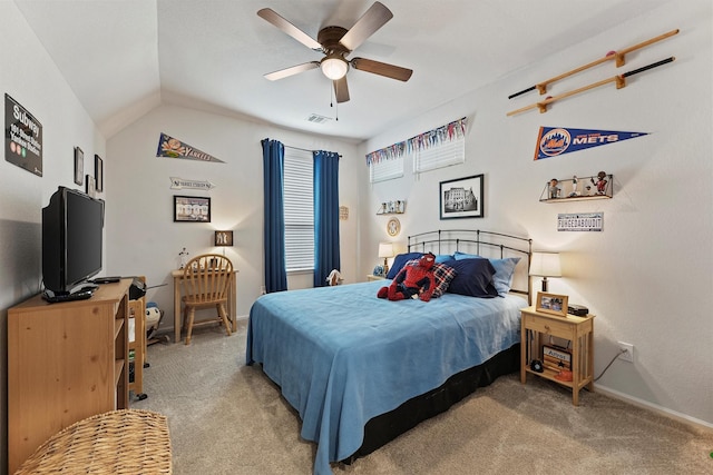 bedroom featuring ceiling fan, lofted ceiling, and light carpet