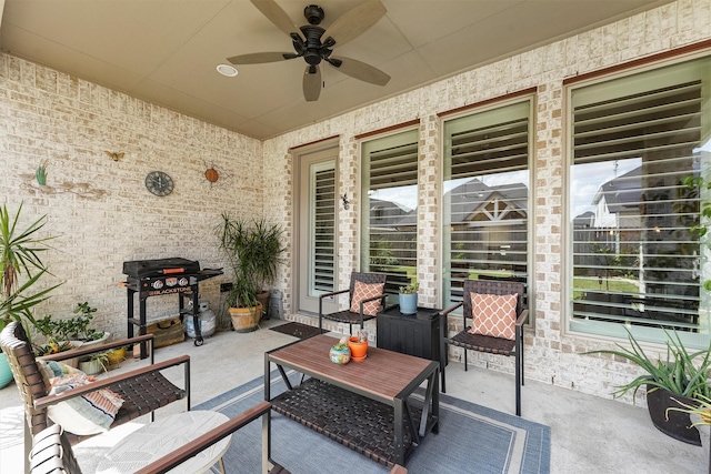 view of patio featuring ceiling fan and a grill