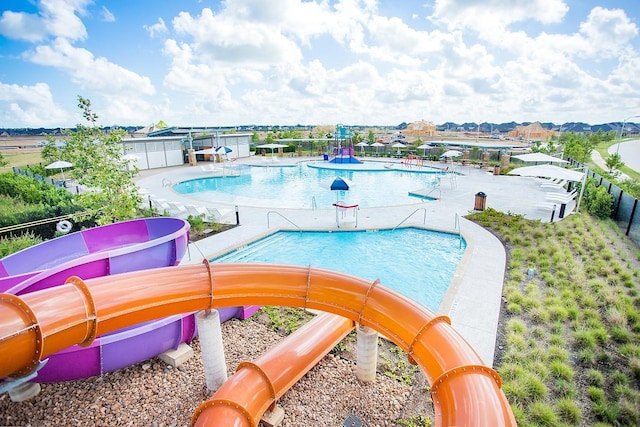 view of swimming pool featuring a water slide