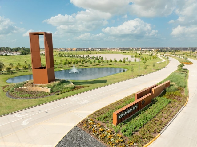 surrounding community featuring a water view