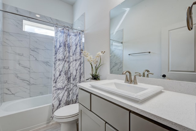 full bath with shower / bath combination with curtain, toilet, and vanity
