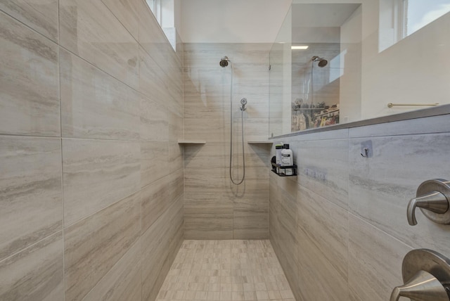 bathroom with tiled shower