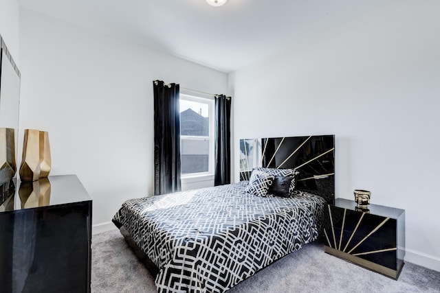 bedroom with carpet floors and baseboards