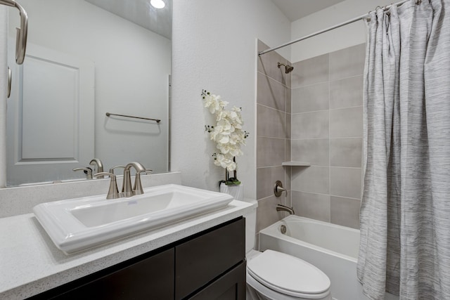 bathroom featuring shower / tub combo, toilet, and vanity