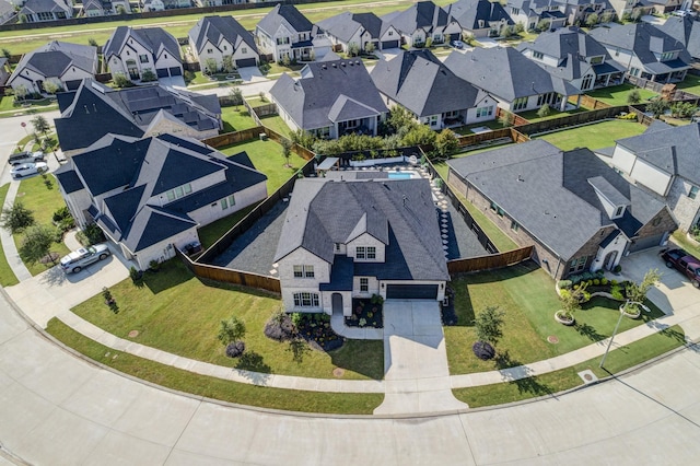 birds eye view of property with a residential view
