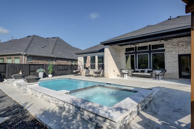 view of pool with a ceiling fan, a patio area, an in ground hot tub, and a fenced backyard