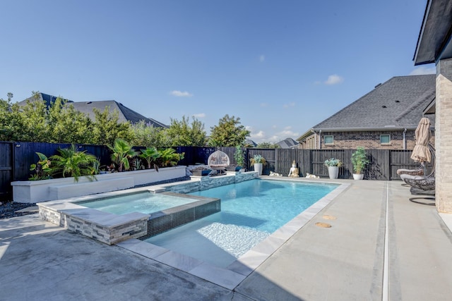 view of swimming pool featuring an in ground hot tub