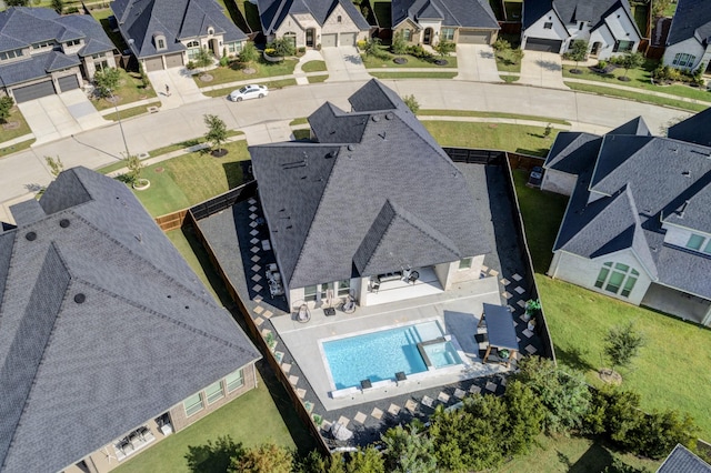 birds eye view of property with a residential view