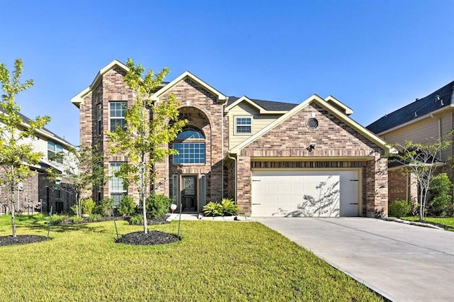 view of front of home with a garage and a front yard