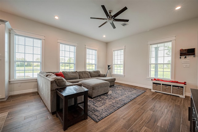 living room featuring hardwood / wood-style floors, a wealth of natural light, and ceiling fan