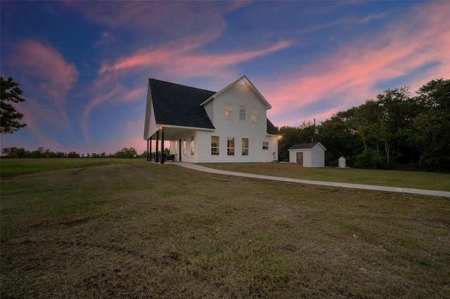 exterior space with a shed and a lawn