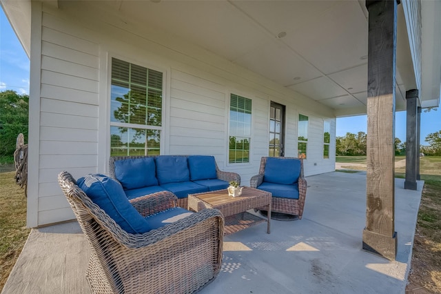 view of patio / terrace featuring covered porch and an outdoor living space