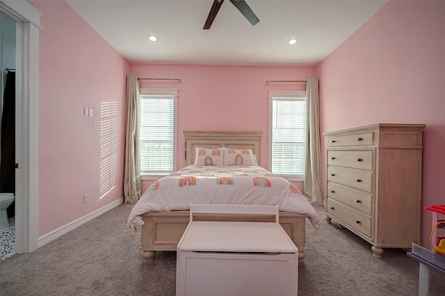 carpeted bedroom with multiple windows and ceiling fan