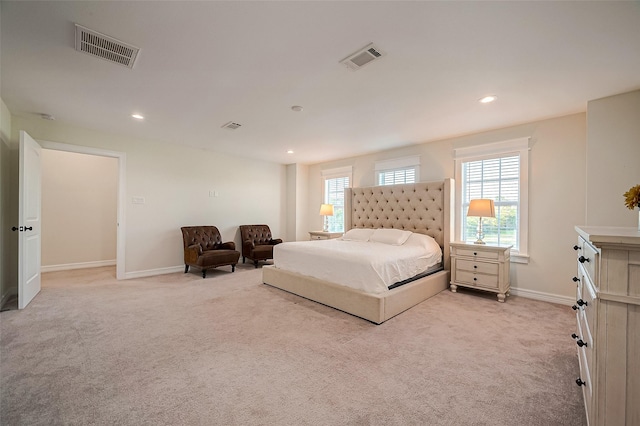 bedroom with light carpet